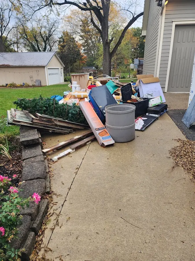 Dumpster being loaded with debris for Demolition Dumpster Rental in Southern Shops